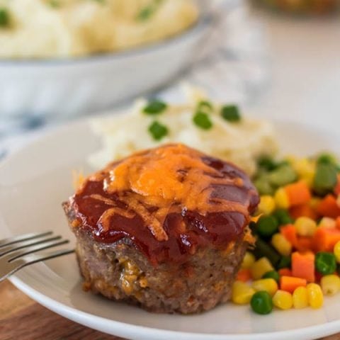This ain't your Momma's meatloaf. These mouthwatering Mini Meatloaves, which have cheese mixed right in and are topped with a sweet sauce that gets baked in, have been one of our family favourites for years.