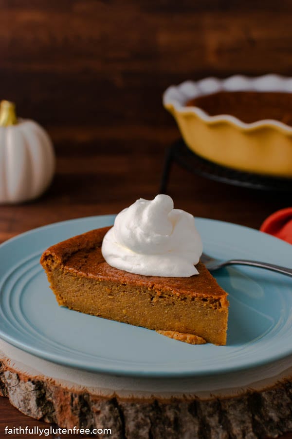 A slice of crustless pumpkin pie on a blue plate