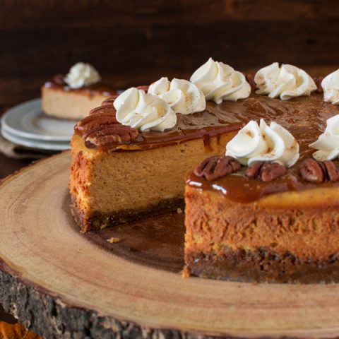 Indulge in this gluten free Pumpkin Cheesecake, with it's velvety texture, warming spices, and nutty crust, everyone is sure to ask for another slice.