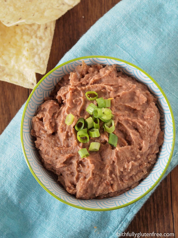 No Mexican meal is complete without a side of these healthy Refried Beans. Learn how easy it is to make your own delicious Refried Beans at home, better than anything you can get in a can, that's for sure!