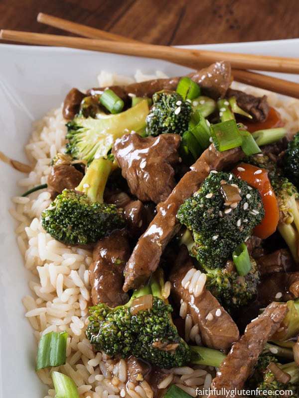 Gluten Free Beef and Broccoli Stir Fry over rice with chopsticks