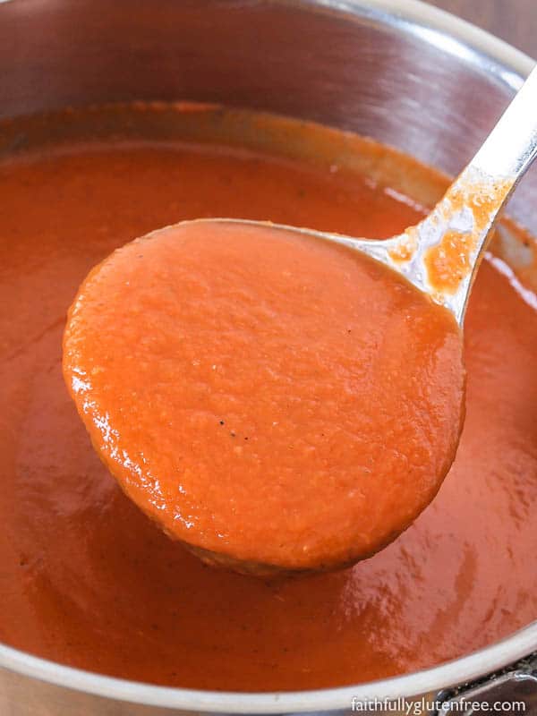 A ladle of creamy gluten free and dairy free tomato soup