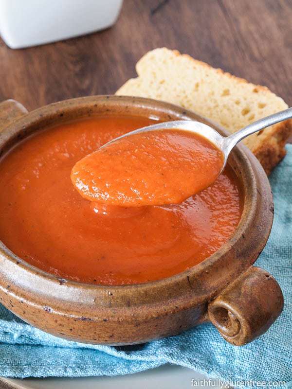 A ceramic bowl full of gluten free tomato soup