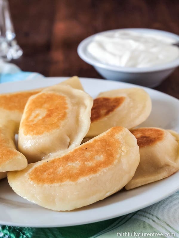 Plate of fried gluten free perogies (pierogi)