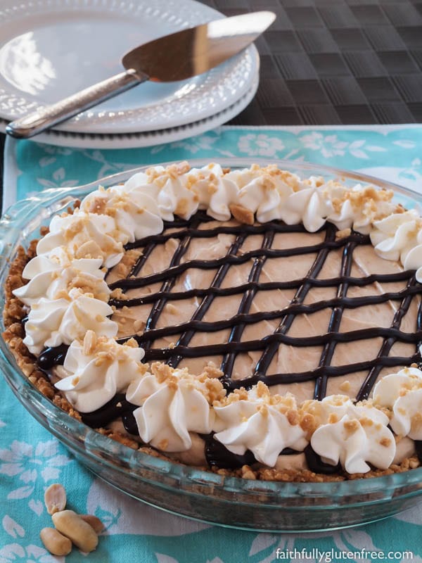 A tall glass of milk or a strong cup of coffee is all that you need to accompany this easy no bake Peanut Butter Pie with Chocolate Covered Pretzel Crust.