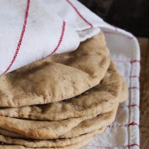 Wrap your hands around these warm, soft, pliable Gluten Free Pita Bread filled with salad, falafels, or gyros.