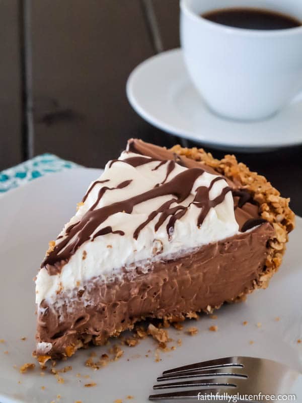 A slice of No Bake Gluten Free Chocolate Cream Pie made with a pretzel crust