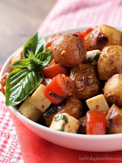 An easy Caprese Potato Salad with Creamer potatoes, tomato, basil, and mozzarella cheese.