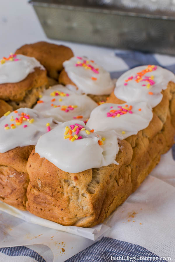 These gluten free Peppernut Buns, also called Papante or Spice Buns, are sweet yeast buns with warming spices, including black pepper. Topped with a simple icing, and sprinkles, they are a traditional Mennonite Easter bun.