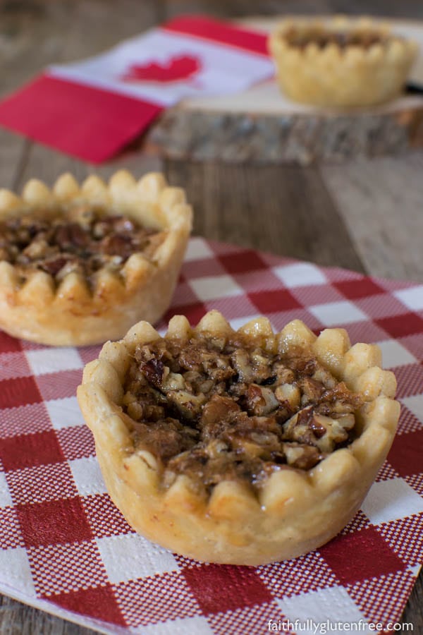 These decadent Gluten Free Maple Butter Tarts, with their crisp, buttery shell and gooey centers, are a true Canadian treasure.