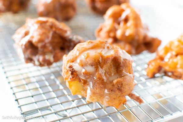 A cooling rack with apple fritters