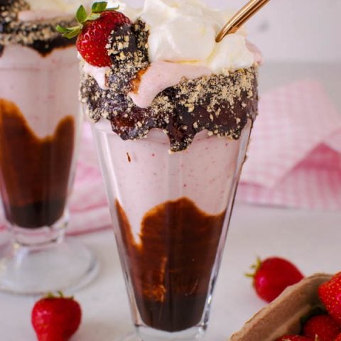 a glass of Strawberry milkshake with chocolate