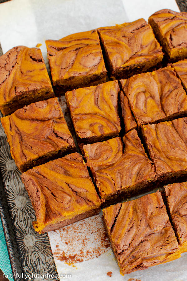 A pan of pumpkin swirl brownies cut into squares