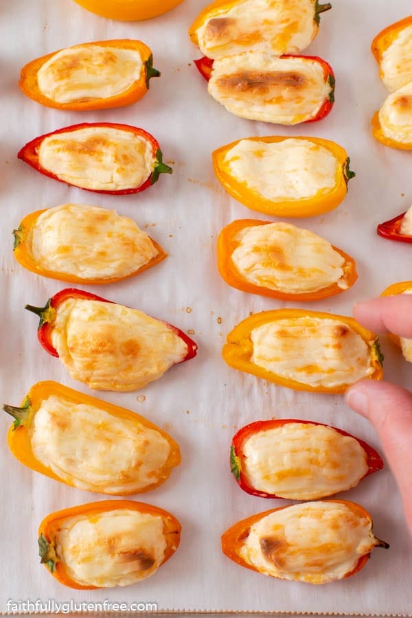 a baking sheet full of stuffed sweet peppers