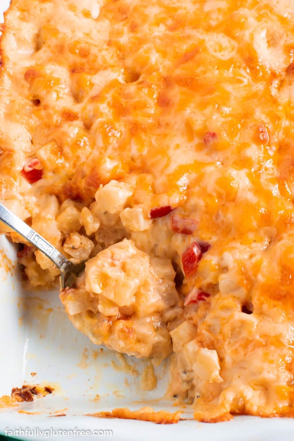 a baking dish with cheesy hashbrown casserole