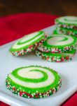 A plate with white and green swirled cookies
